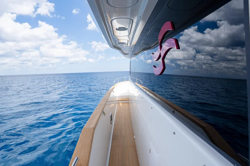 Slide: The Image of Sirena 58 yacht cruising on open sea under clear blue sky, 2025 model. - 32