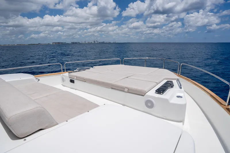 Slide: The Image of Luxurious Sirena 58 yacht deck with sun loungers, 2025 model, cruising on open sea. - 35