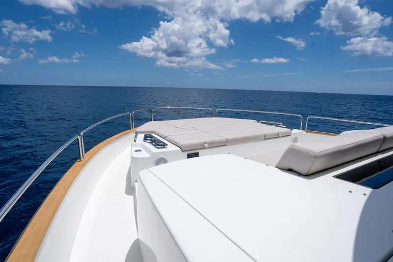 Slide: The Image of Luxurious Sirena 58 yacht deck with sun loungers, 2025 model, cruising on open sea. - 36
