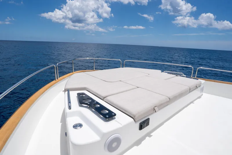 Slide: The Image of Luxurious sun deck on 2025 Sirena 58 yacht with ocean view and clear skies. - 37