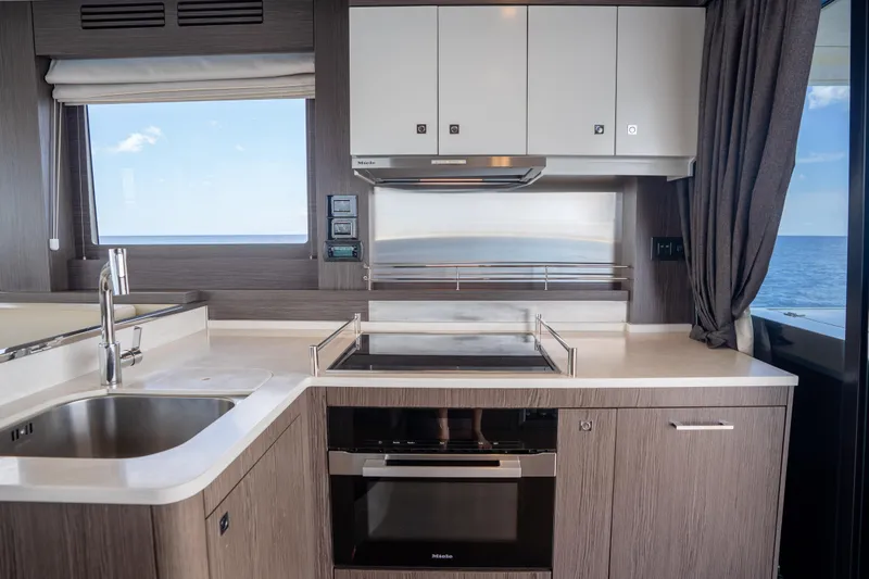 Slide: The Image of Modern kitchen interior on 2025 Sirena 58 yacht with ocean view. - 42