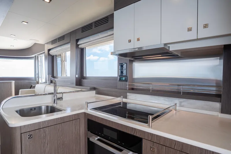 Slide: The Image of Modern kitchen interior on 2025 Sirena 58 yacht, featuring sleek design and stainless steel appliances. - 43