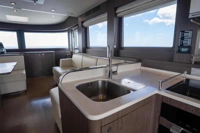 Slide: The Image of Luxurious interior of 2025 Sirena 58 yacht featuring modern kitchen and seating area. - 44