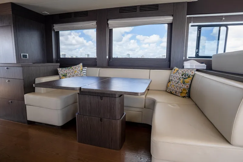 Slide: The Image of Luxurious interior of 2025 Sirena 58 yacht with elegant seating and scenic windows. - 47