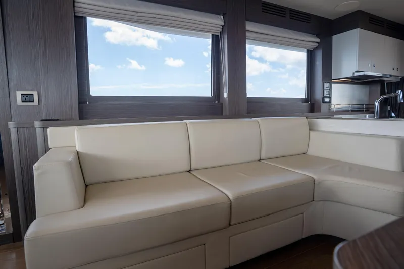 Slide: The Image of Luxurious interior of 2025 Sirena 58 yacht with cream leather seating and ocean view. - 48