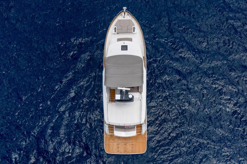 Slide: The Image of Aerial view of 2025 Sirena 58 yacht cruising on deep blue ocean waters. - 5
