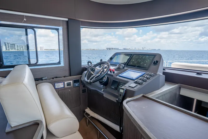 Slide: The Image of Helm of 2025 Sirena 58 yacht with modern navigation equipment and ocean view. - 50