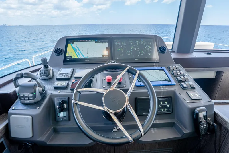 Slide: The Image of Helm of 2025 Sirena 58 yacht with advanced navigation displays and controls. - 51