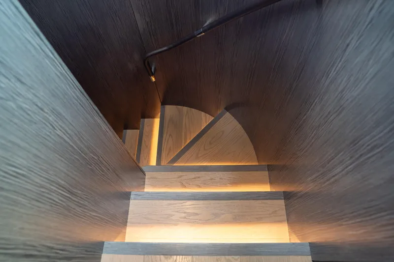 Slide: The Image of Spiral staircase with ambient lighting in Sirena 58 yacht, 2025 model. - 57