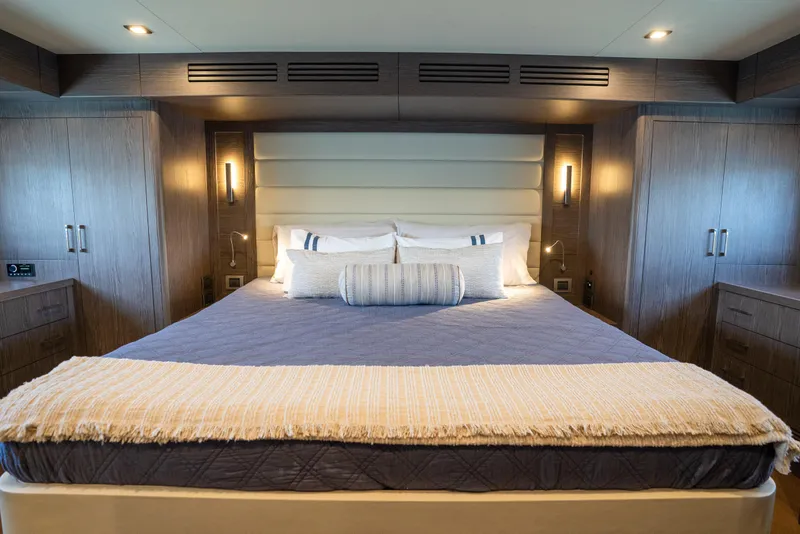 Slide: The Image of Luxurious bedroom interior of 2025 Sirena 58 yacht with elegant bedding and modern lighting. - 59