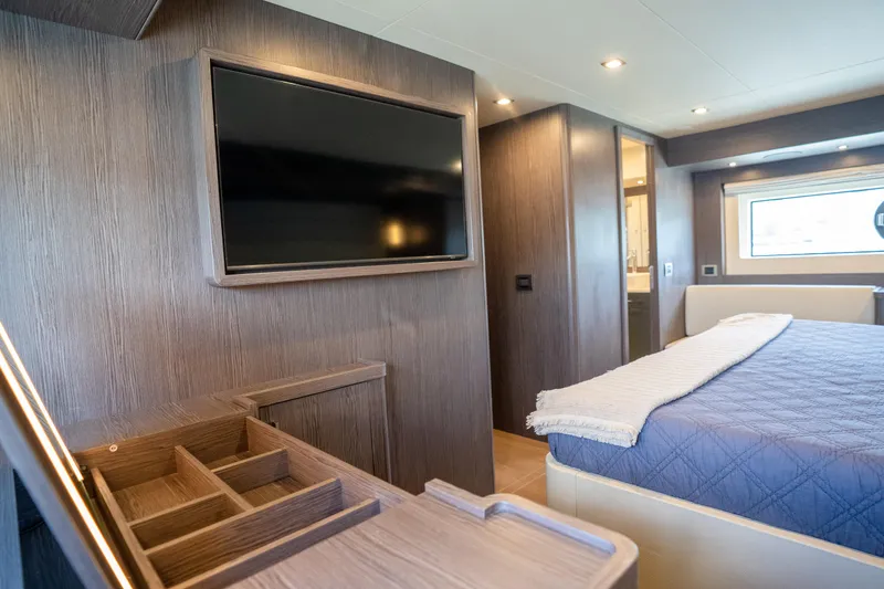 Slide: The Image of Luxurious interior of 2025 Sirena 58 yacht with modern bedroom and TV. - 62