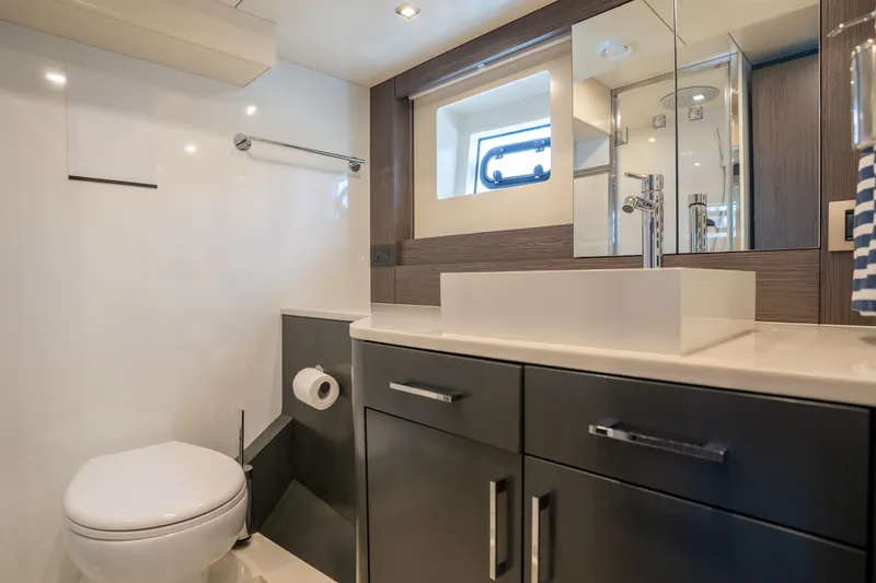 Slide: The Image of Modern bathroom interior on 2025 Sirena 58 yacht, featuring sleek fixtures and elegant design. - 63