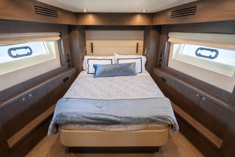 Slide: The Image of Luxurious cabin interior of 2025 Sirena 58 yacht with elegant bedding and wood accents. - 67