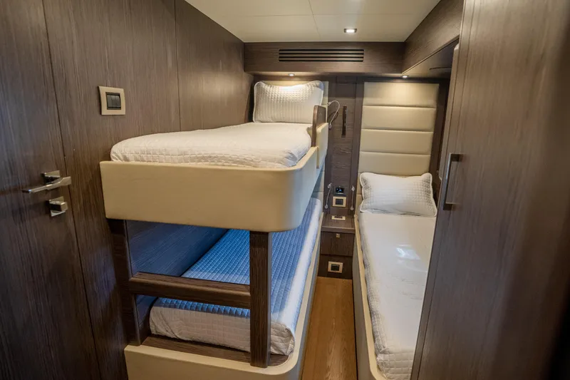 Slide: The Image of Interior of 2025 Sirena 58 yacht cabin with bunk beds and modern design. - 70