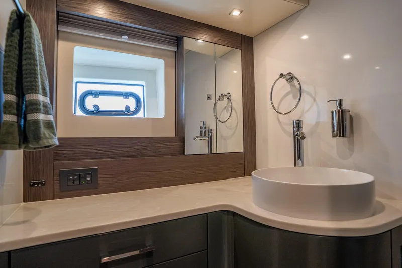 Slide: The Image of Modern bathroom interior of 2025 Sirena 58 yacht with sleek sink and mirror. - 72