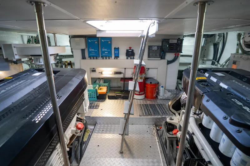 Slide: The Image of Engine room of 2025 Sirena 58 yacht, featuring dual engines and organized equipment layout. - 76
