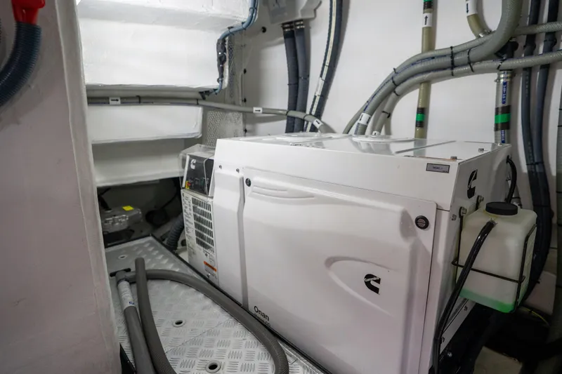Slide: The Image of Engine room of 2025 Sirena 58 yacht with Cummins generator and wiring. - 80