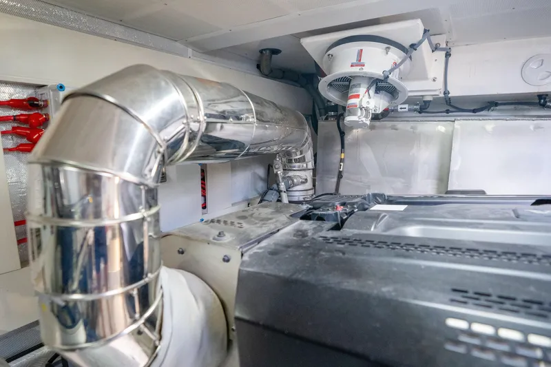 Slide: The Image of Engine room of 2025 Sirena 58 yacht with metallic piping and ventilation system. - 81