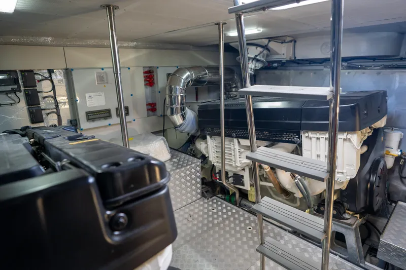 Slide: The Image of Engine room of 2025 Sirena 58 yacht, featuring modern equipment and ladder access. - 82