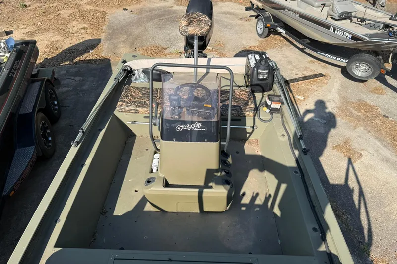 Slide: The Image of 2020 Tracker Grizzly 1860 CC Sportsman boat, interior view, parked on a trailer. - 8