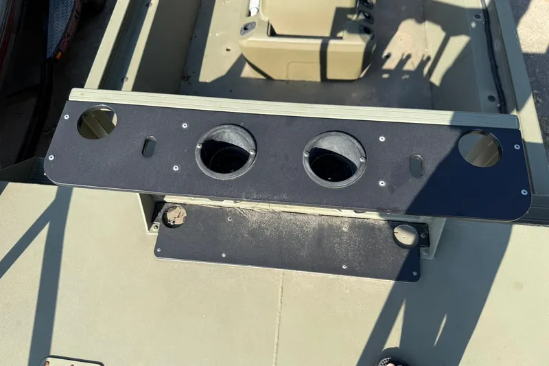Slide: The Image of 2020 Tracker Grizzly 1860 CC Sportsman boat interior with cup holders and seating area. - 9