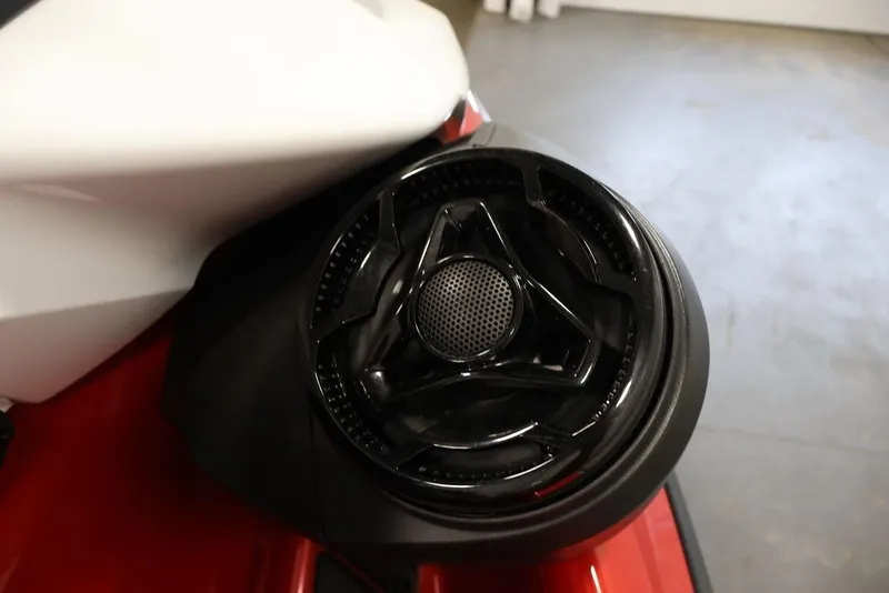 Slide: The Image of Close-up of 2026 Sea-Doo RXP-X 325 speaker detail, showcasing sleek black design. - 11
