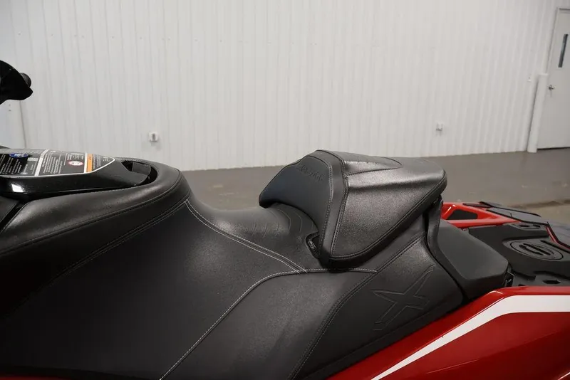 Slide: The Image of 2026 Sea-Doo RXP-X 325 jet ski seat, featuring sleek black design and ergonomic contours. - 19