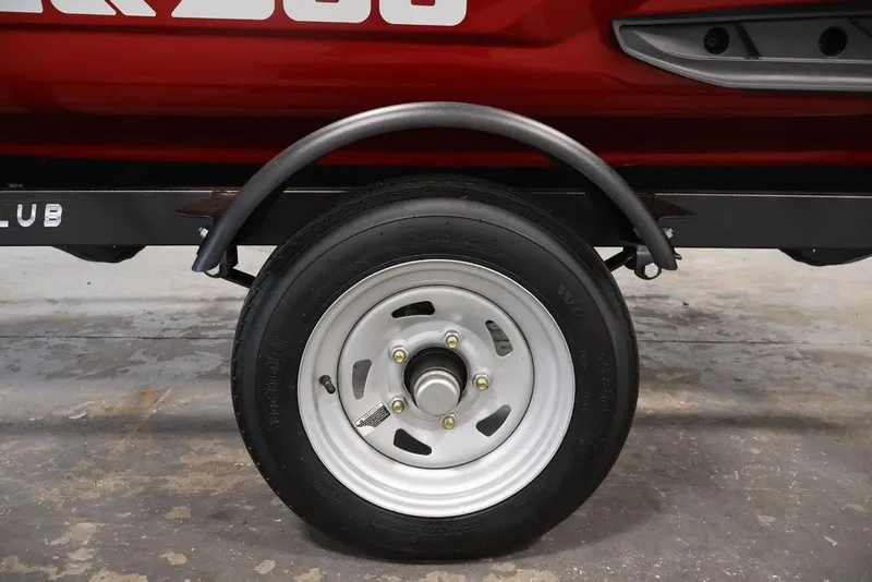 Slide: The Image of Trailer wheel for 2026 Sea-Doo RXP-X 325, featuring a sturdy metal fender. - 2