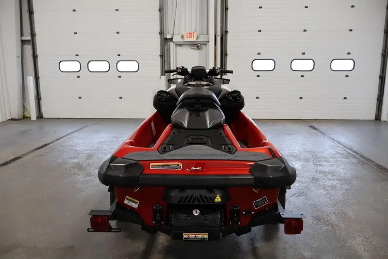 Slide: The Image of 2026 Sea-Doo RXP-X 325 jet ski in a garage, rear view. - 8