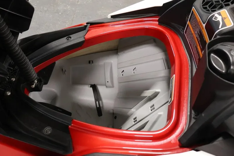 Slide: The Image of Open storage compartment of 2026 Sea-Doo RXP-X 325 watercraft, showcasing interior design. - 9