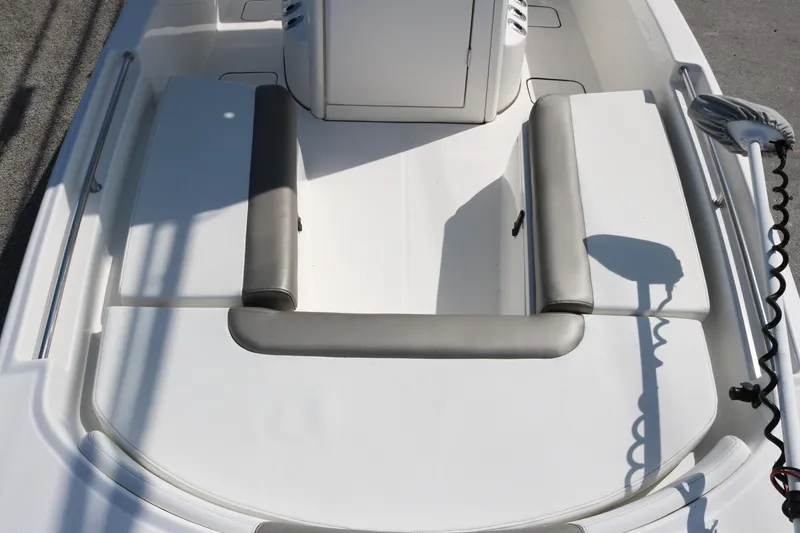 Slide: The Image of 2023 World Cat 235 CC boat interior with cushioned seating and sleek design. - 12