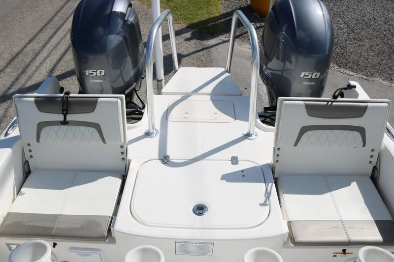 Slide: The Image of 2023 World Cat 235 CC boat with dual Yamaha 150 engines, rear seating view. - 17