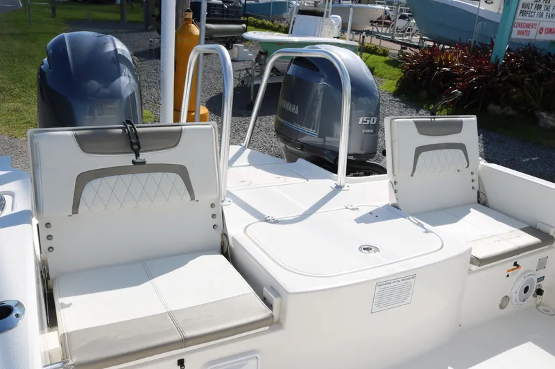Slide: The Image of 2023 World Cat 235 CC boat with Yamaha 150 engine, featuring comfortable seating. - 18