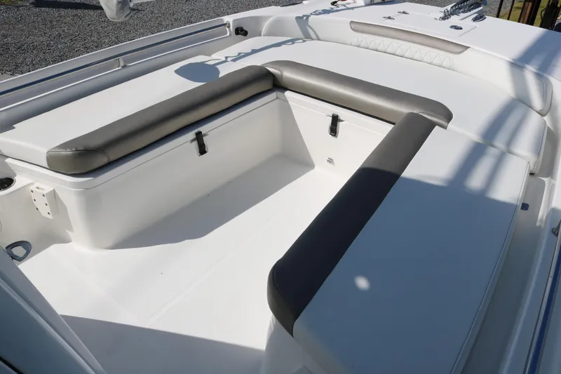 Slide: The Image of 2023 World Cat 235 CC boat interior with cushioned seating and storage compartments. - 8