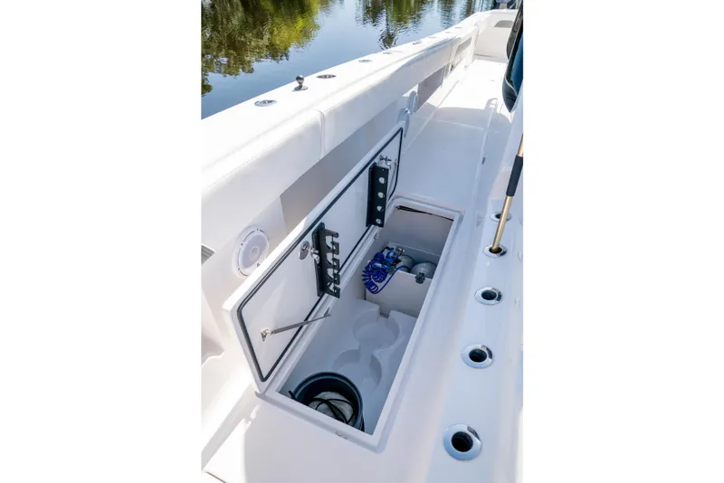 Slide: The Image of Open storage compartment on 2025 Front Runner 43 Catamaran, showcasing interior features and equipment. - 10