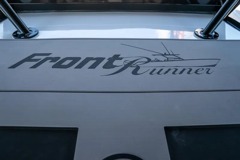 Slide: The Image of Front Runner 43 Catamaran 2025 logo on boat deck, showcasing sleek design. - 11