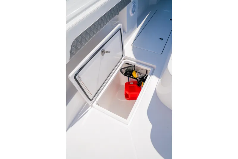 Slide: The Image of Open storage compartment on 2025 Front Runner 43 Catamaran deck, containing equipment. - 14