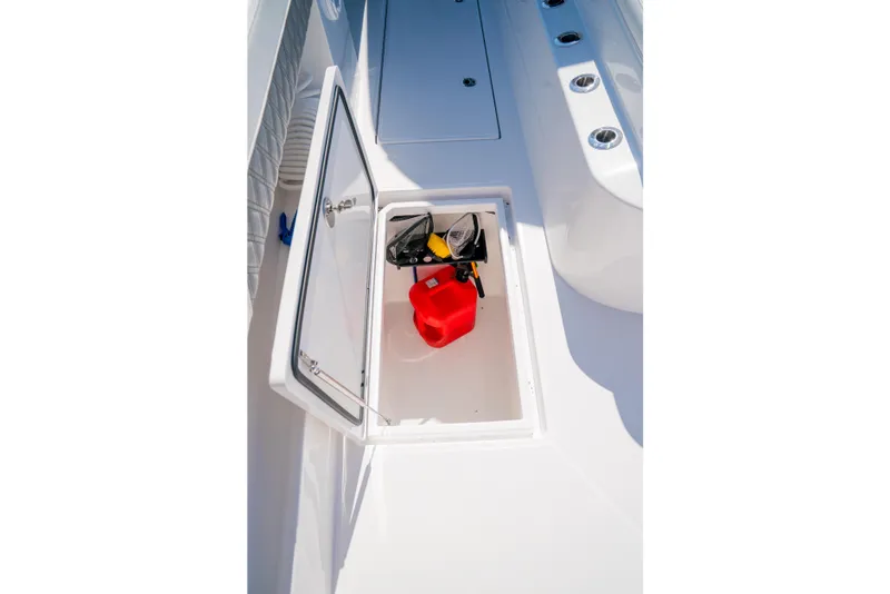 Slide: The Image of Storage compartment on 2025 Front Runner 43 Catamaran with red fuel container and equipment. - 17