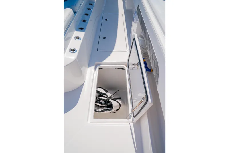 Slide: The Image of Open storage compartment on 2025 Front Runner 43 Catamaran deck. - 21