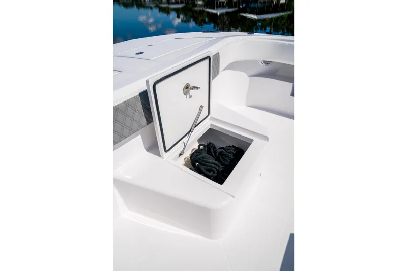 Slide: The Image of Storage compartment on 2025 Front Runner 43 Catamaran, featuring neatly coiled ropes. - 24