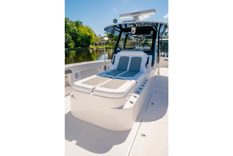 Slide: The Image of 2025 Front Runner 43 Catamaran with luxurious seating on a sunny day by the water. - 25