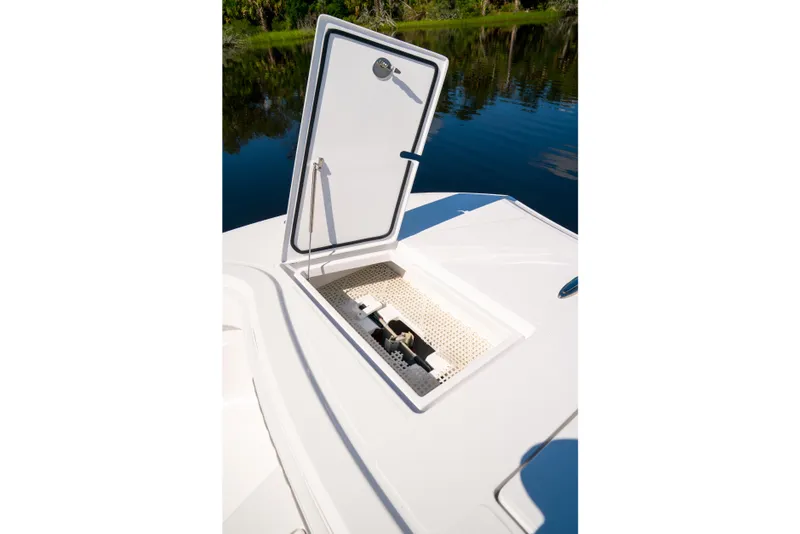 Slide: The Image of Open hatch on 2025 Front Runner 43 Catamaran, revealing storage compartment by the water. - 30