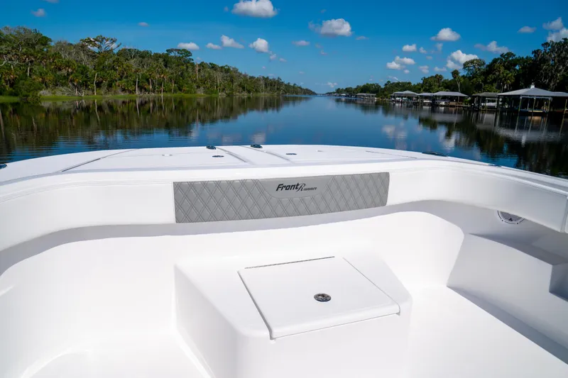 Slide: The Image of Front Runner 43 Catamaran 2025 on serene river with lush greenery and blue sky. - 33