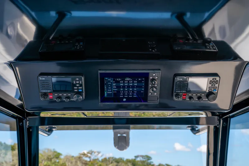 Slide: The Image of Control panel of 2025 Front Runner 43 Catamaran with advanced navigation systems. - 36