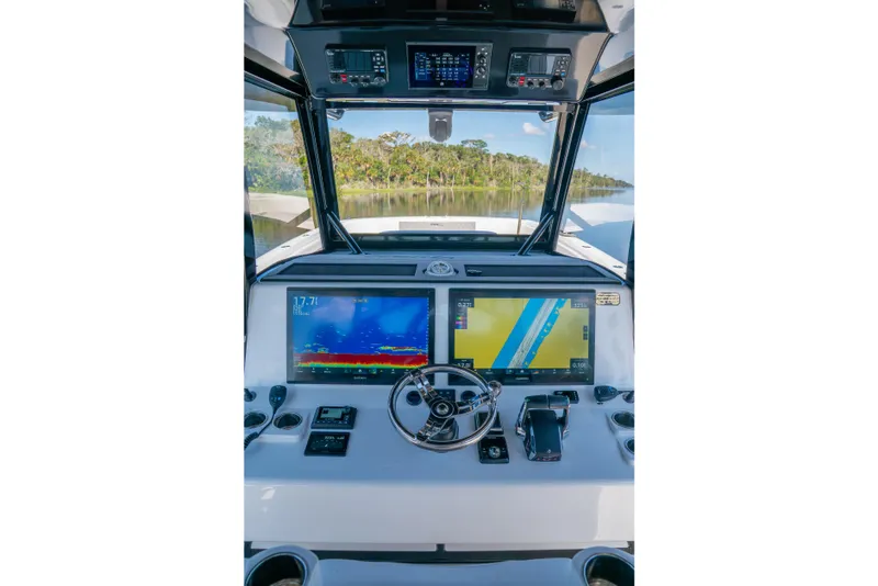 Slide: The Image of Cockpit of 2025 Front Runner 43 Catamaran with advanced navigation displays and controls. - 38