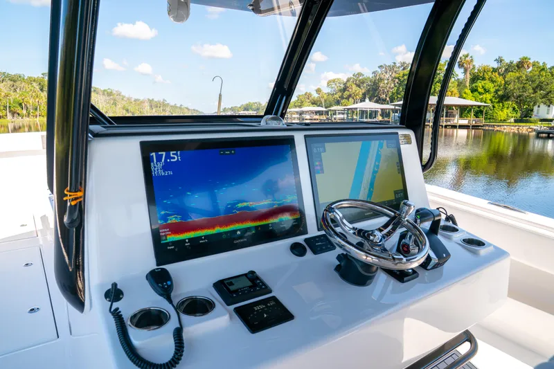 Slide: The Image of Helm of 2025 Front Runner 43 Catamaran with advanced navigation displays and controls. - 39