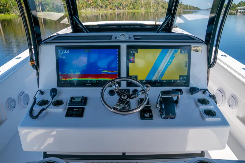 Slide: The Image of Helm of 2025 Front Runner 43 Catamaran with advanced navigation displays and controls. - 41
