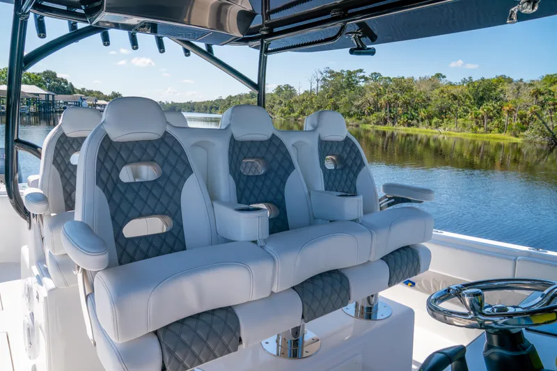Slide: The Image of Luxurious seating on 2025 Front Runner 43 Catamaran, overlooking serene waterway. - 43