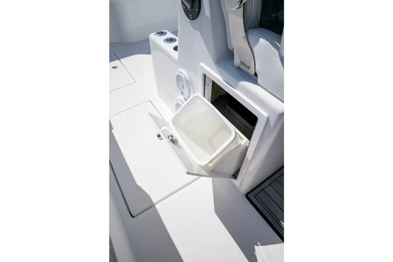 Slide: The Image of 2025 Front Runner 43 Catamaran interior with built-in storage compartment and white bucket. - 45