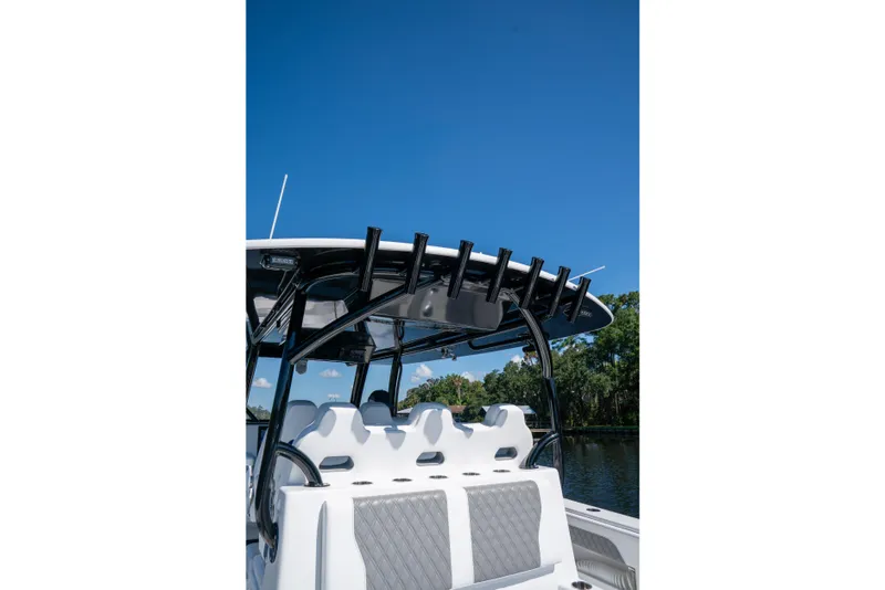 Slide: The Image of 2025 Front Runner 43 Catamaran with sleek seating and rod holders under clear blue sky. - 50